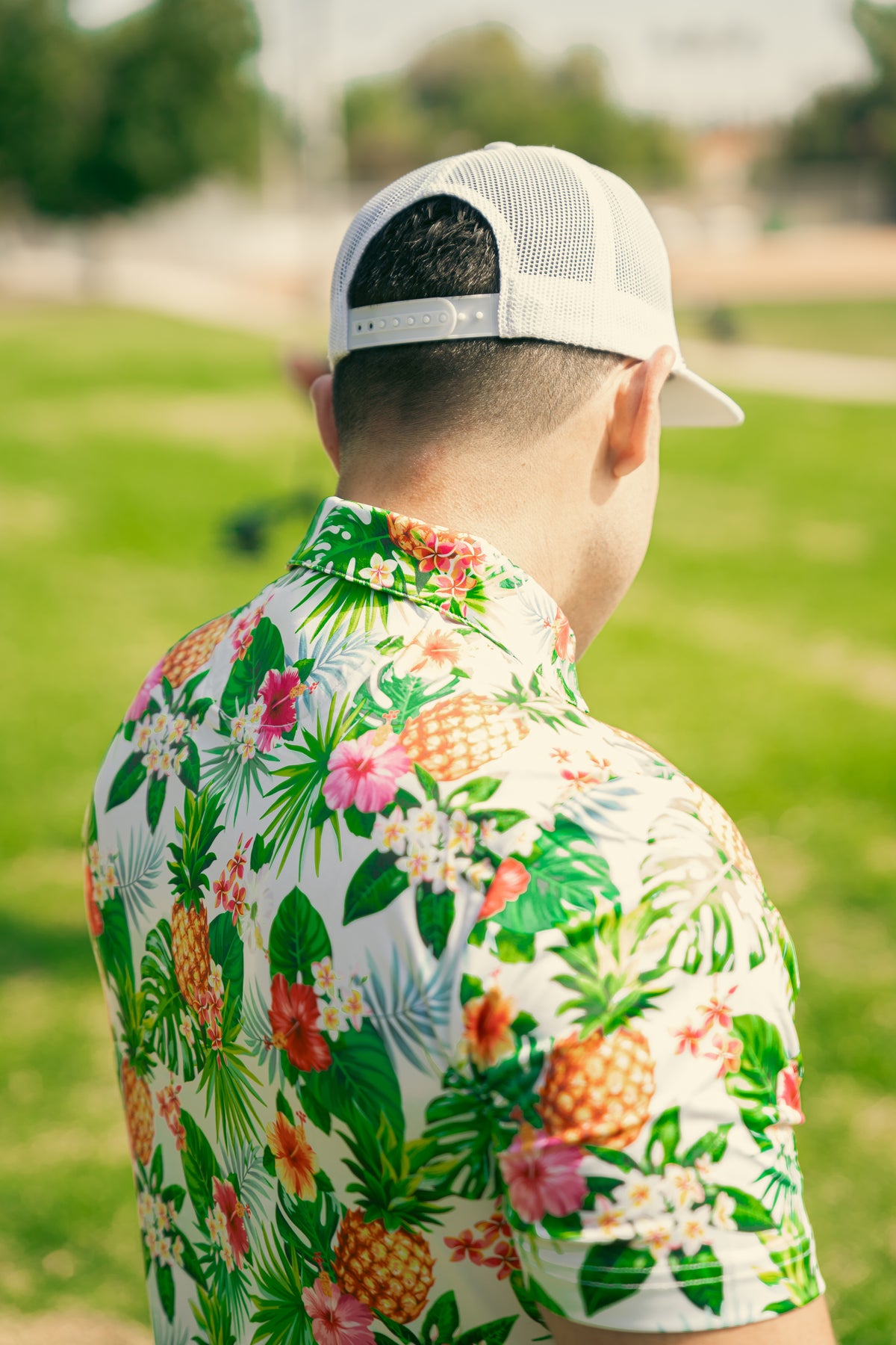 colorful golf polo with fruits on it